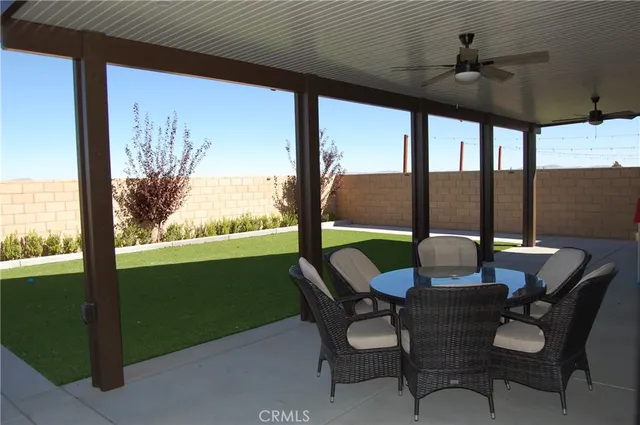 a view of an outdoor dining space with furniture