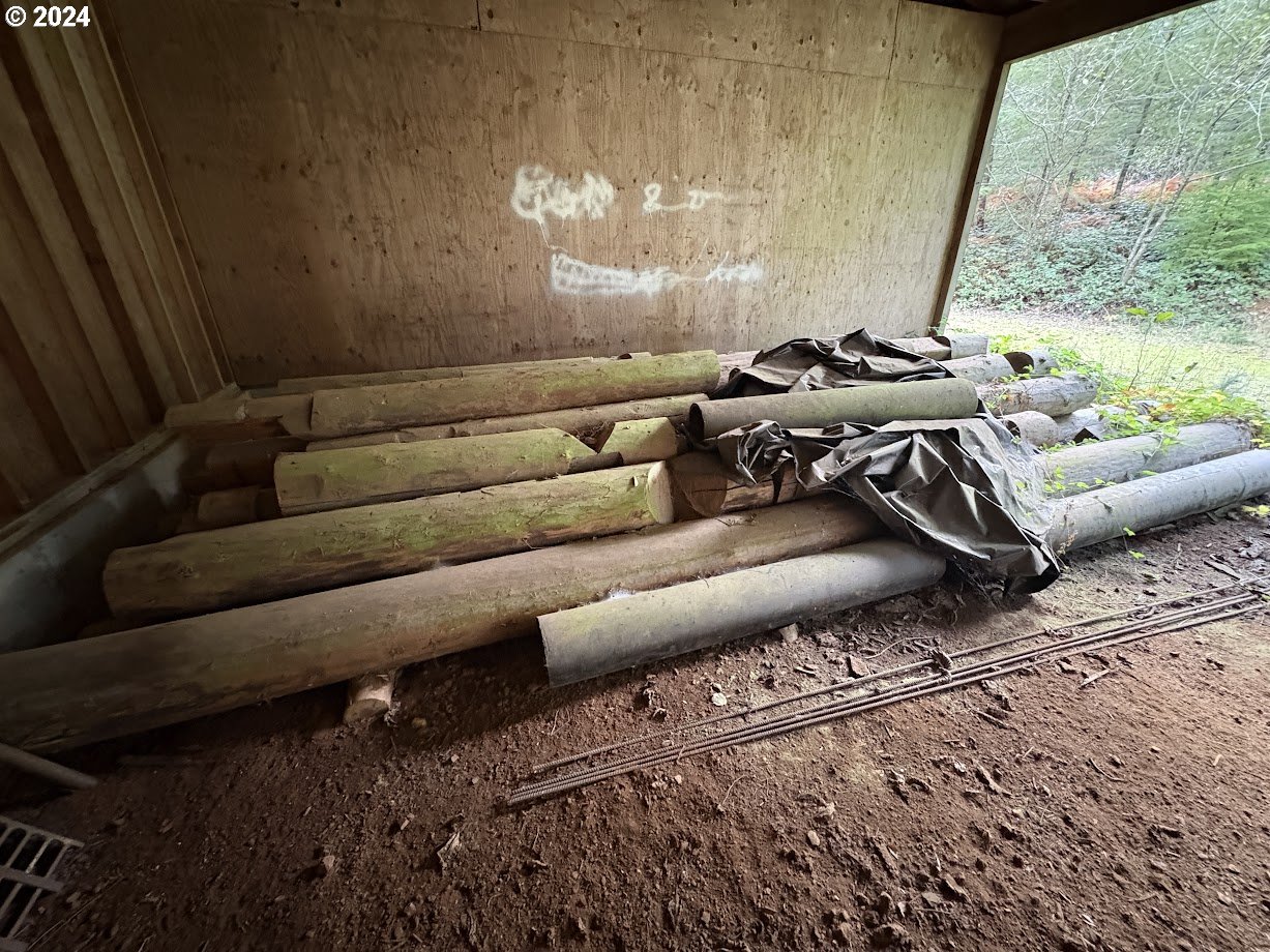 32218 Northeast 86th Street Camas, WA 98607 - Photo 18 of 23 a living room with furniture and a floor to ceiling window