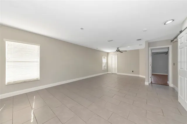 a view of an empty room with a window