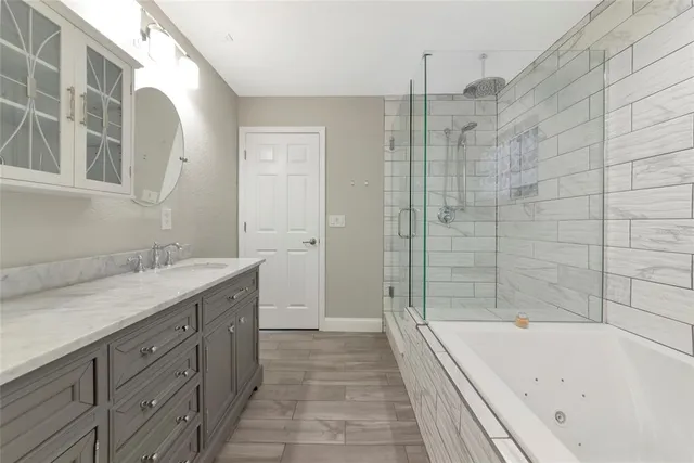 a bathroom with a bathtub and a sink