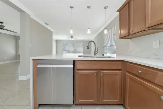 a kitchen with cabinets appliances and a counter space