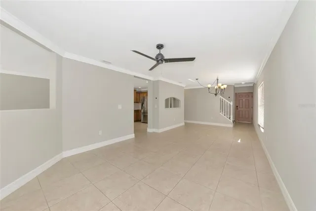 a view of a kitchen with furniture and a ceiling fan
