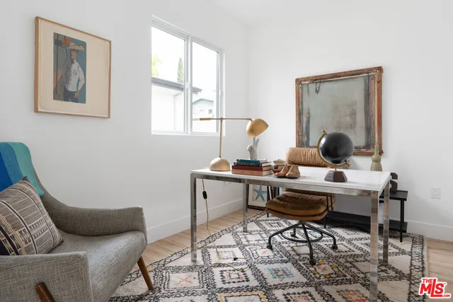 a work room with furniture and a window