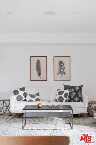 a living room with furniture and rug