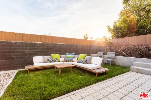 a view of a patio with swimming pool