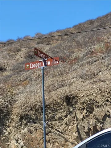 a view of a street with a building in the background