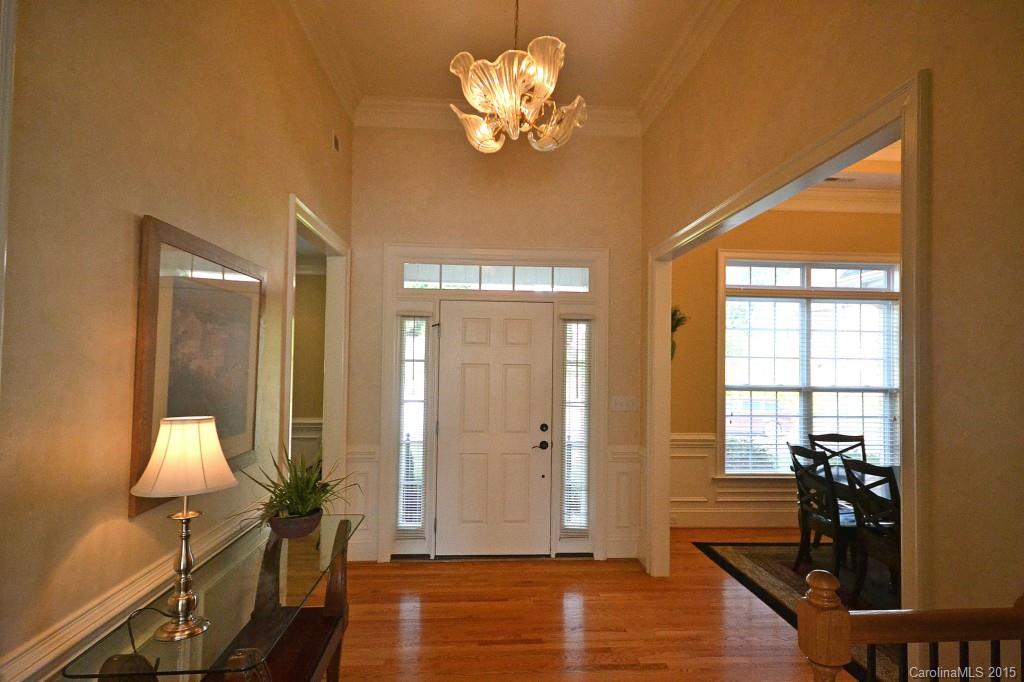 943 Ashford Way Fort Mill, SC 29708 - Photo 3 of 22 a view of a livingroom with wooden floor and a chandelier