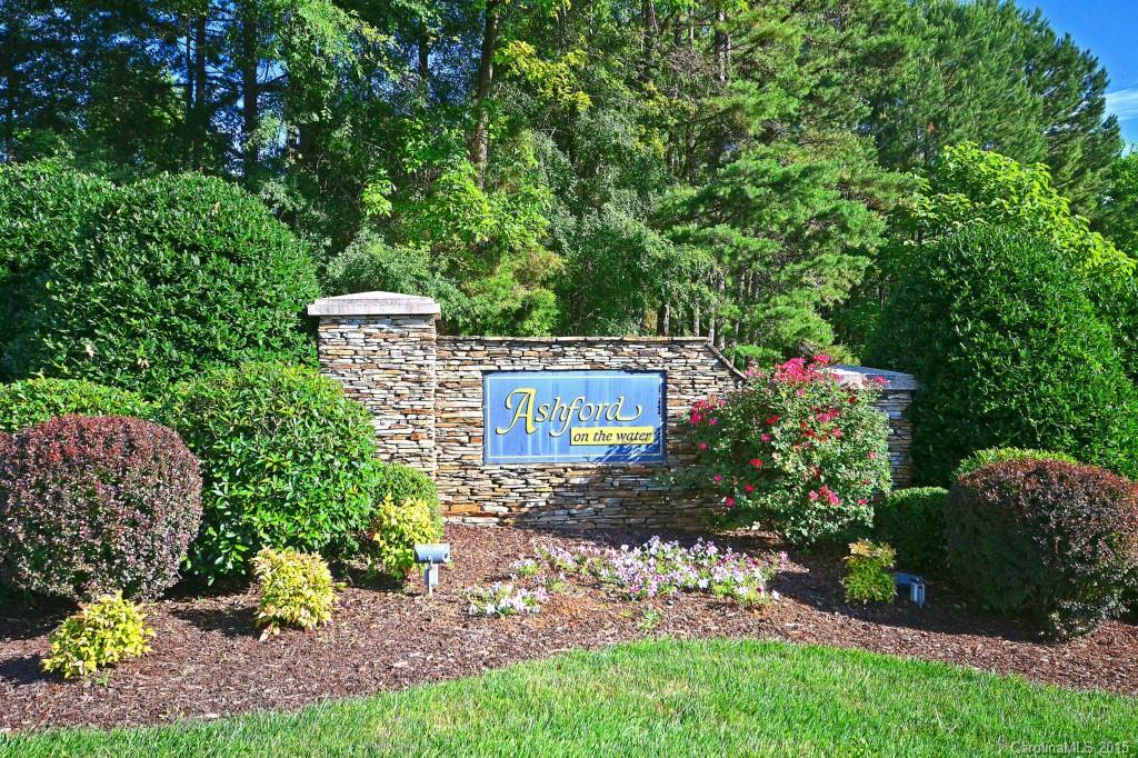 943 Ashford Way Fort Mill, SC 29708 - Photo 22 of 22 a view of a sign in a yard with plants and large trees