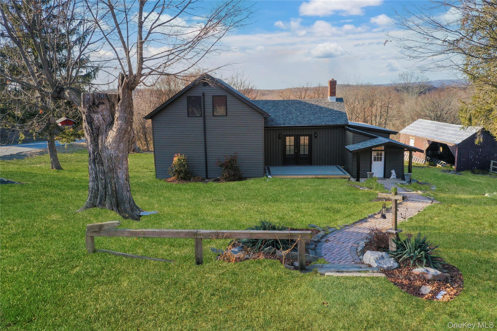 67 Jacobs Road Westtown, NY 10998 - Photo 3 of 36 Rear view of house featuring a lawn, a chimney, and a deck