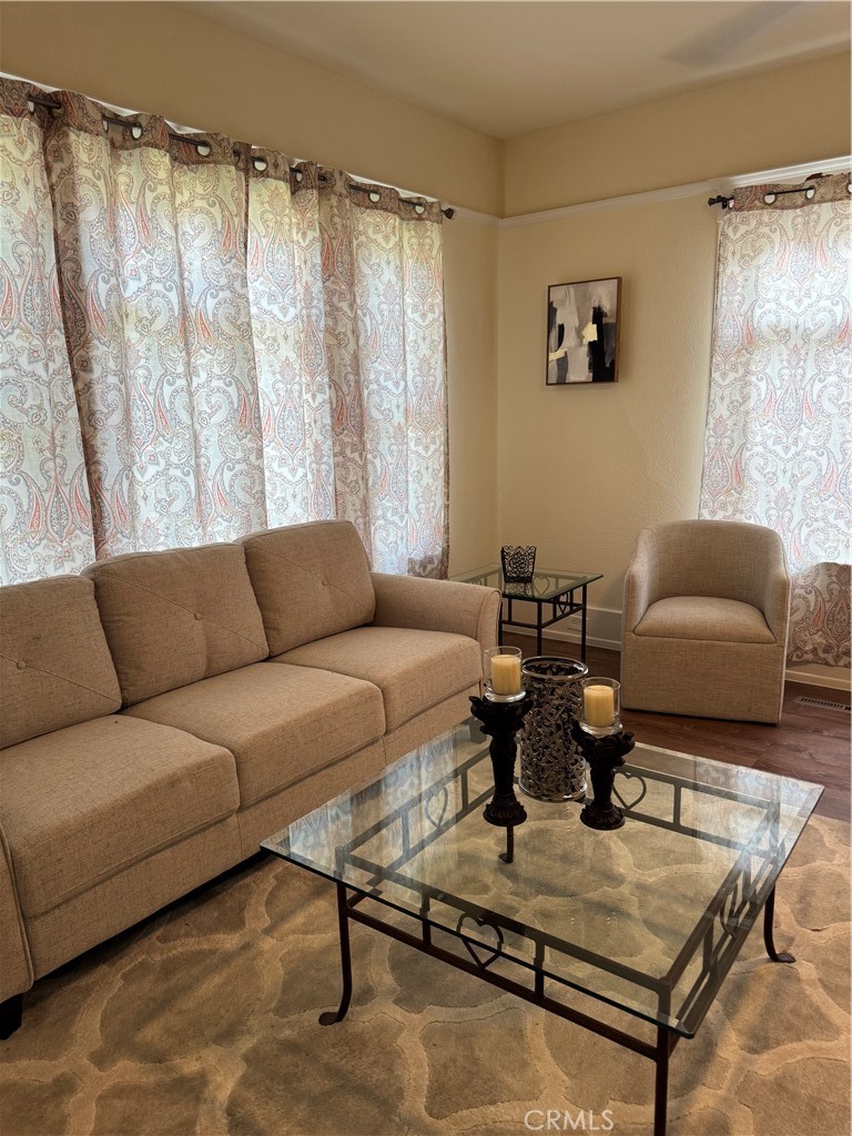 3857 Pine Street Riverside, CA 92501 - Photo 11 of 28 a living room with furniture and a window