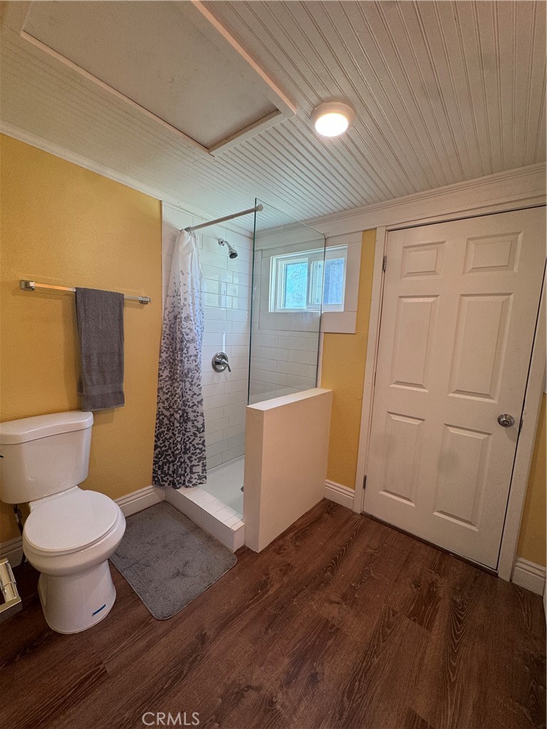 3857 Pine Street Riverside, CA 92501 - Photo 13 of 28 a bathroom with a toilet and a shower