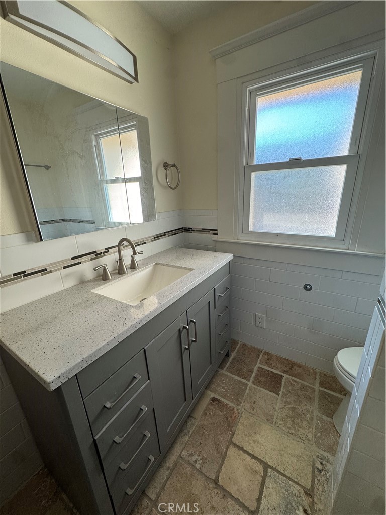 3857 Pine Street Riverside, CA 92501 - Photo 17 of 28 a bathroom with a sink and a vanity