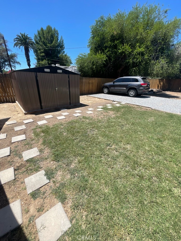 3857 Pine Street Riverside, CA 92501 - Photo 26 of 28 a view of a backyard with wooden fence