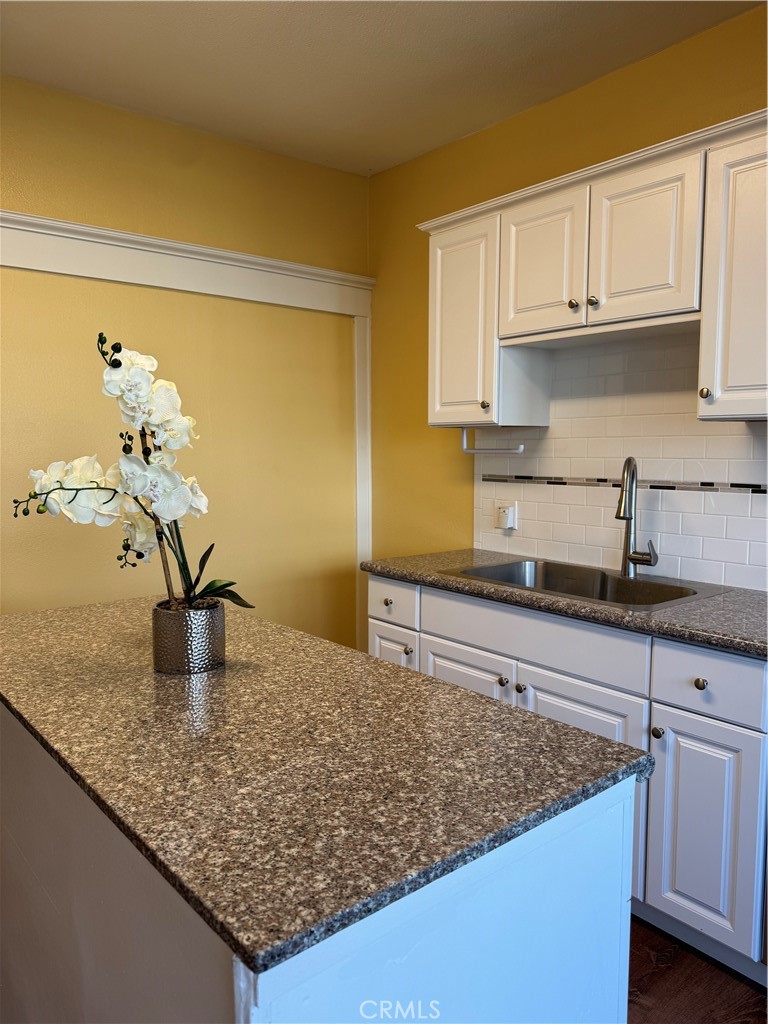 3857 Pine Street Riverside, CA 92501 - Photo 6 of 28 a kitchen with a sink and cabinets