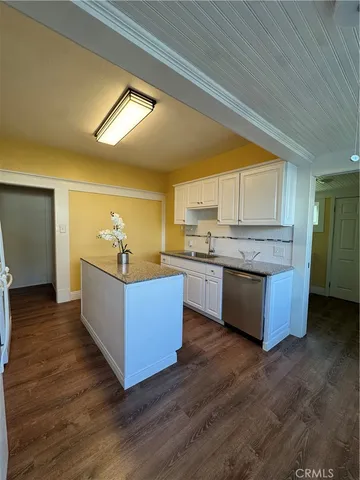 a kitchen with a table and chairs in it