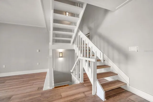 a bathroom with a double vanity sink a mirror and shower