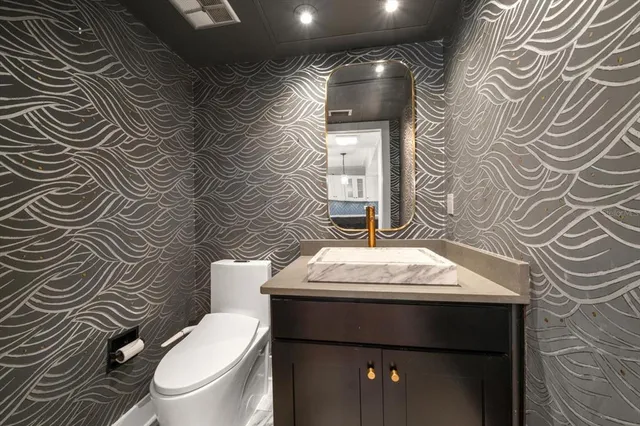 a view of a lake with a house in the background