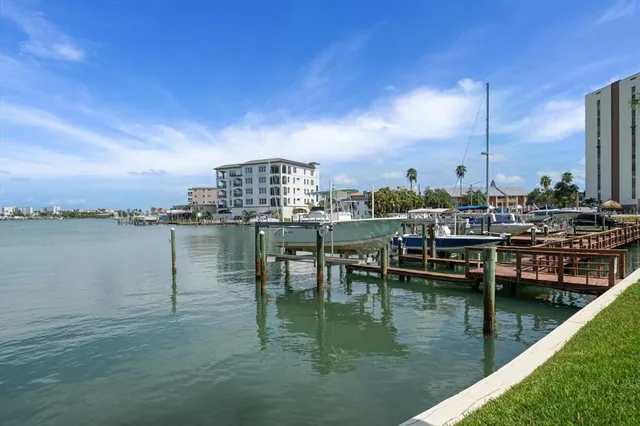 a view of a house with backyard porch and sitting area