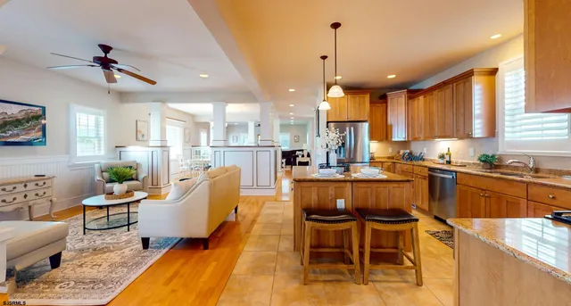 a large kitchen with a table and chairs