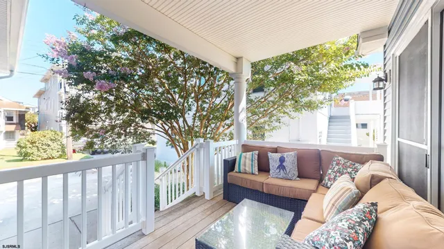 a bathroom with a granite countertop toilet and a sink