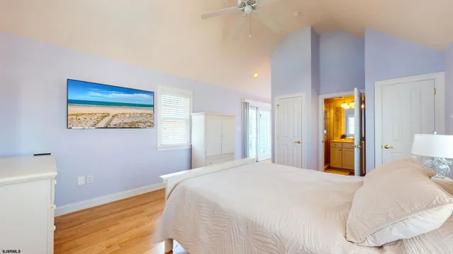 a bathroom with a granite countertop a toilet and a shower