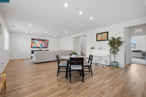 a living room with lots of furniture and a book shelf