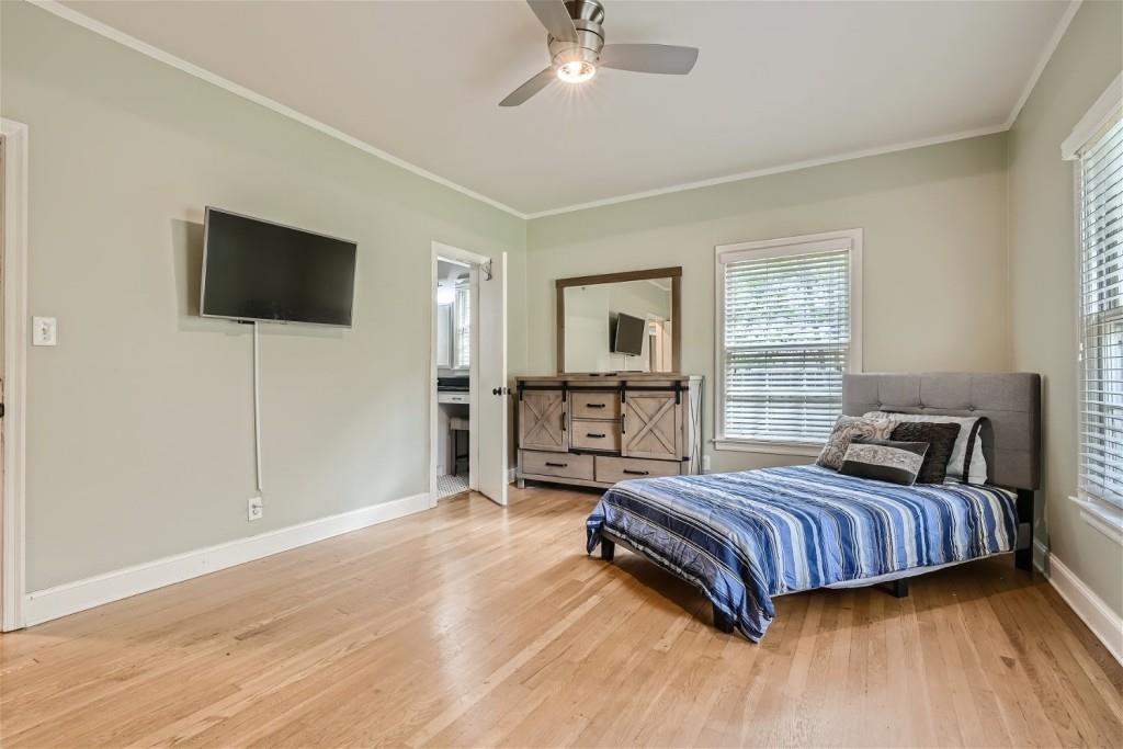 3685 Cantrell Road Northeast Atlanta, GA 30319 - Photo 11 of 25 a bedroom with a bed and a flat screen tv