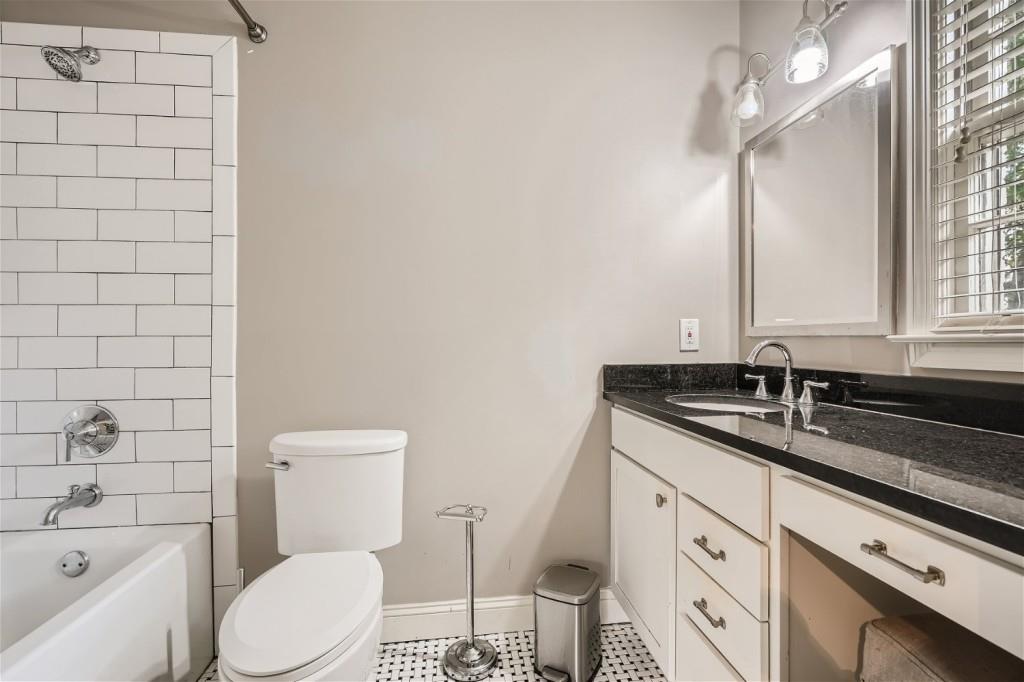 3685 Cantrell Road Northeast Atlanta, GA 30319 - Photo 12 of 25 a bathroom with a granite countertop sink toilet and shower
