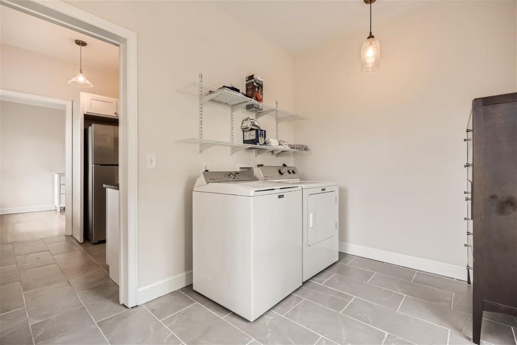 3685 Cantrell Road Northeast Atlanta, GA 30319 - Photo 17 of 25 a utility room with cabinets washer and dryer