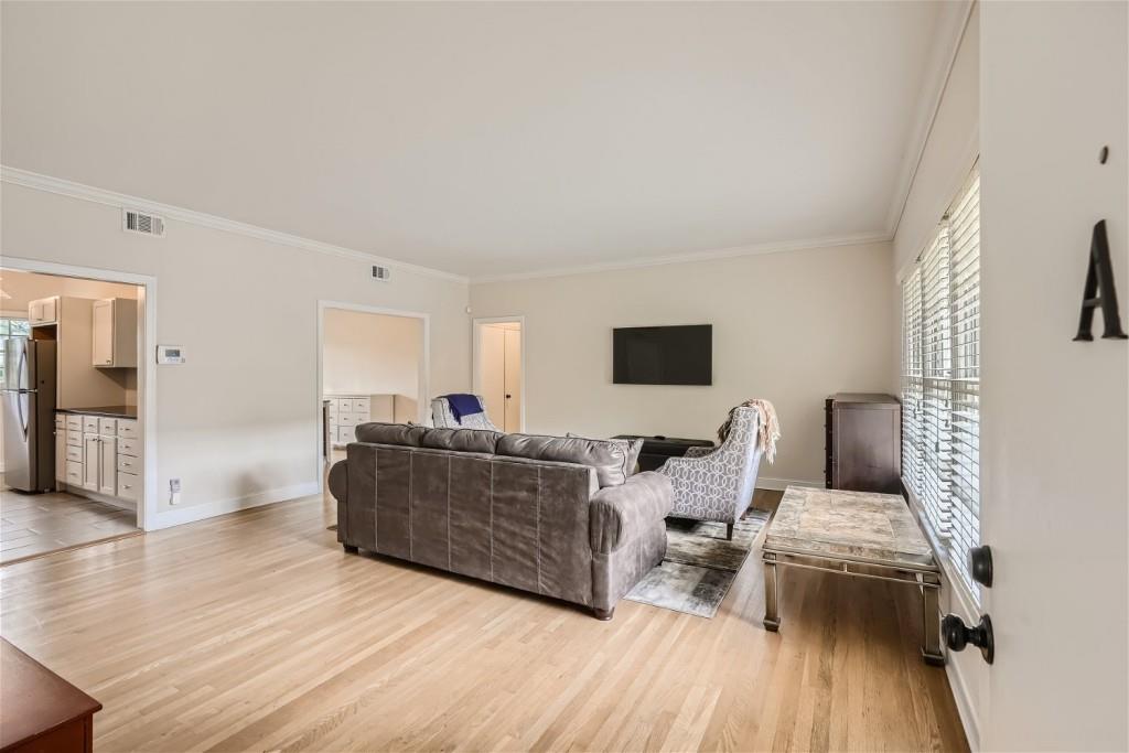 3685 Cantrell Road Northeast Atlanta, GA 30319 - Photo 20 of 25 a living room with furniture and a flat screen tv
