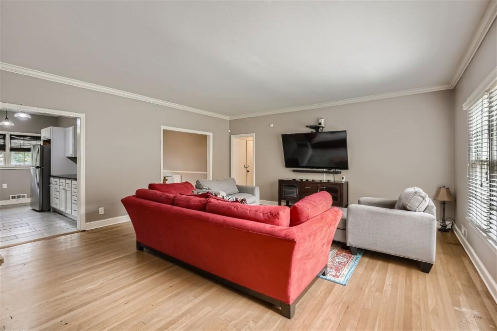 3685 Cantrell Road Northeast Atlanta, GA 30319 - Photo 3 of 25 a living room with furniture and a flat screen tv