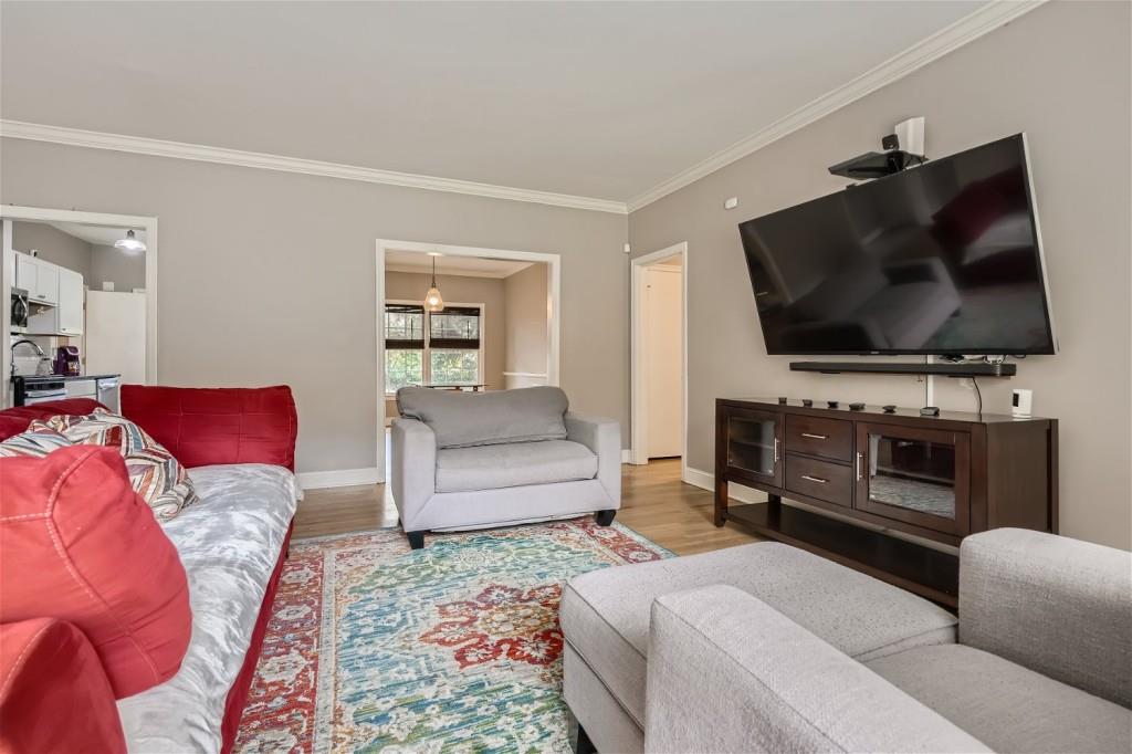 3685 Cantrell Road Northeast Atlanta, GA 30319 - Photo 4 of 25 a living room with furniture and a flat screen tv