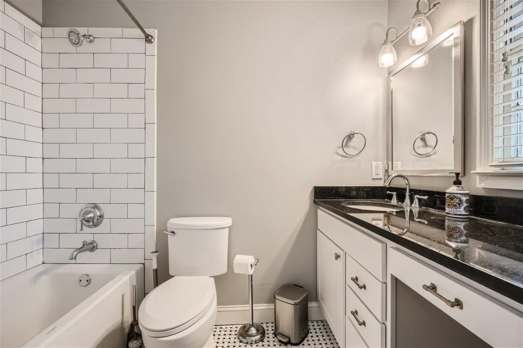 3685 Cantrell Road Northeast Atlanta, GA 30319 - Photo 10 of 25 a bathroom with a granite countertop sink a toilet and bathtub
