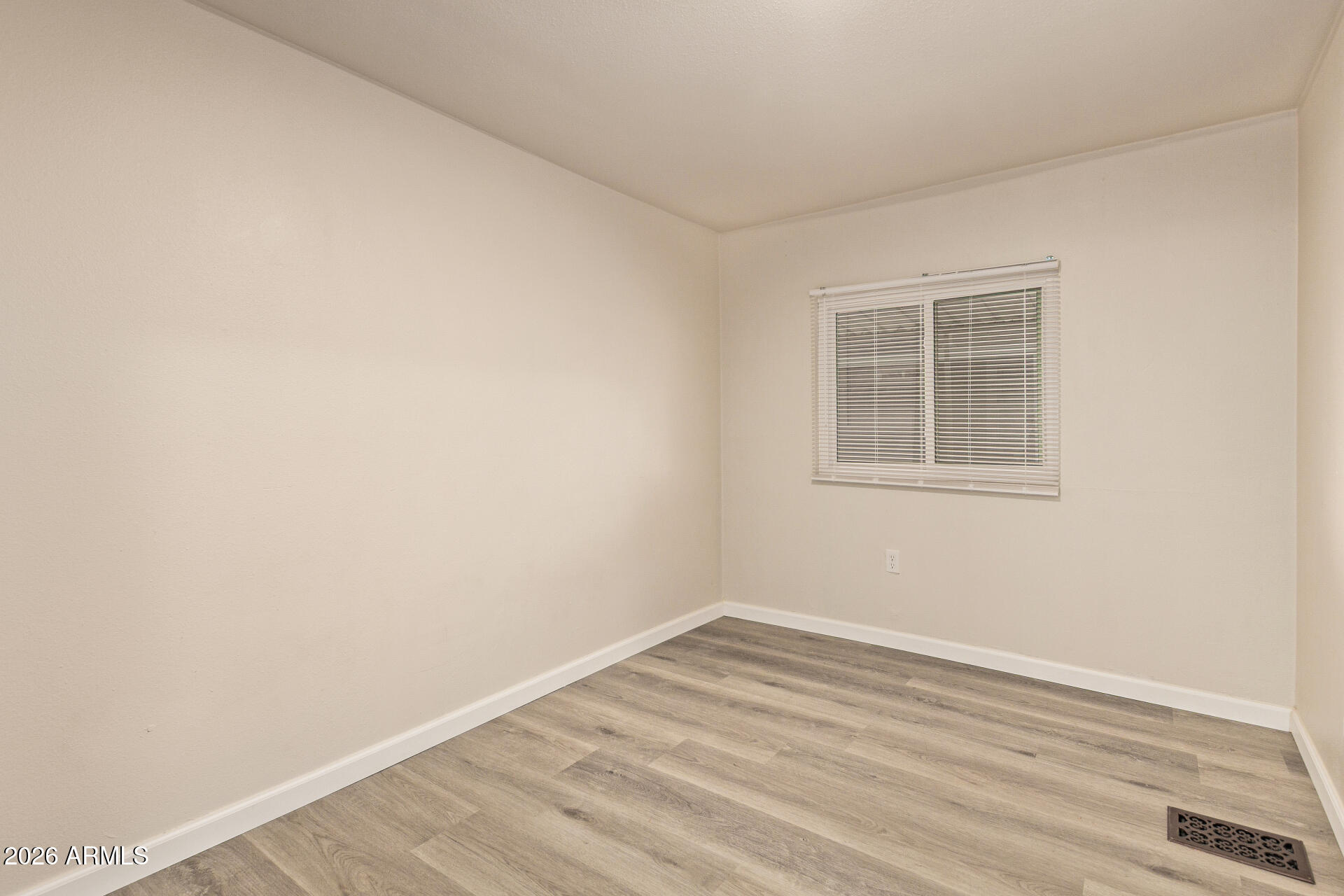 400 West Baseline Road, Unit 312 Tempe, AZ 85283 - Photo 17 of 32 a view of empty room with wooden floor and fan