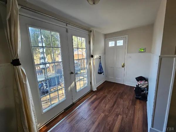 a view of entryway with wooden floor