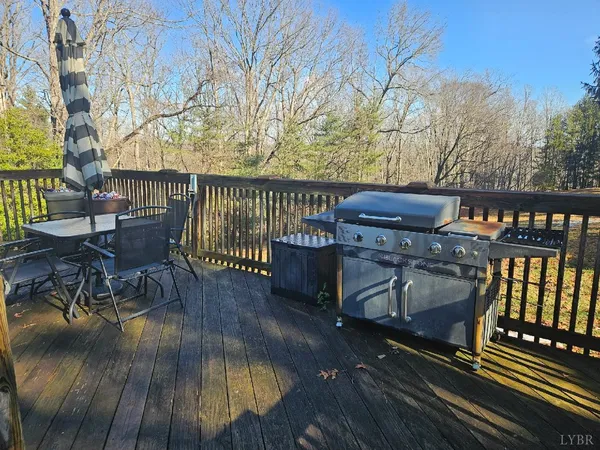 a view of balcony with wooden floor and outdoor seating