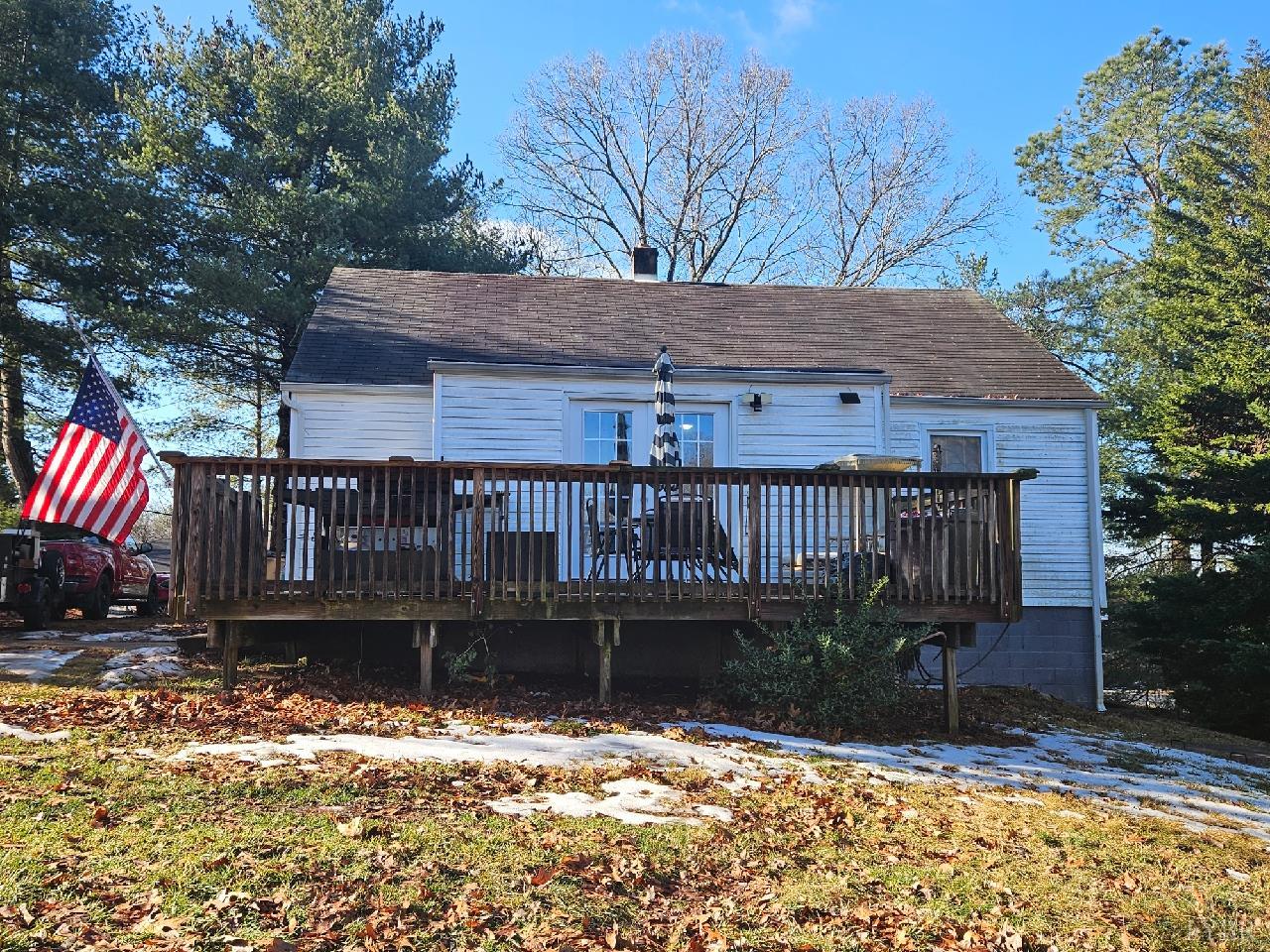 114 Riverview Road Hurt, VA 24563 - Photo 17 of 19 a view of a house with large windows and a small yard