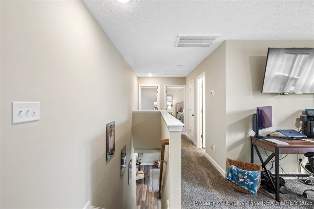 5512 Tolarsville Road St. Pauls, NC 28384 - Photo 16 of 30 a view of a workspace with furniture and a window