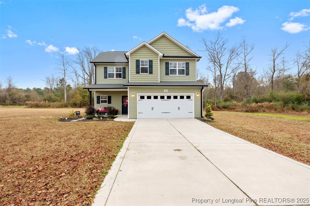 5512 Tolarsville Road St. Pauls, NC 28384 - Photo 2 of 30 a view of a house with a yard