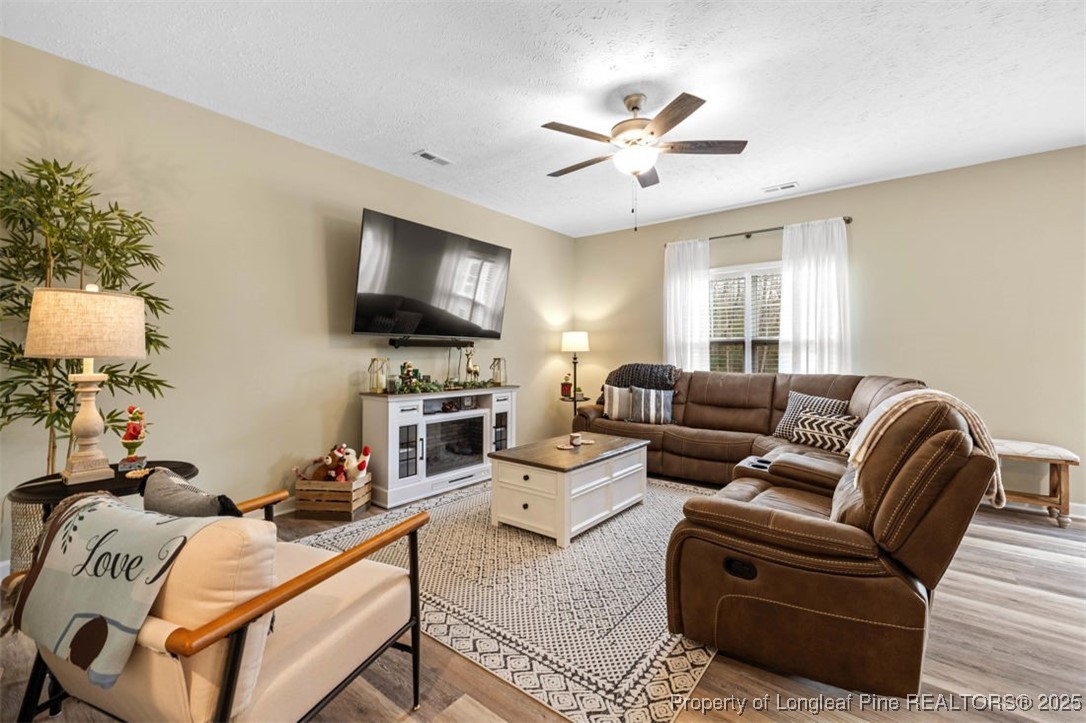 5512 Tolarsville Road St. Pauls, NC 28384 - Photo 6 of 30 a living room with furniture a flat screen tv and a window