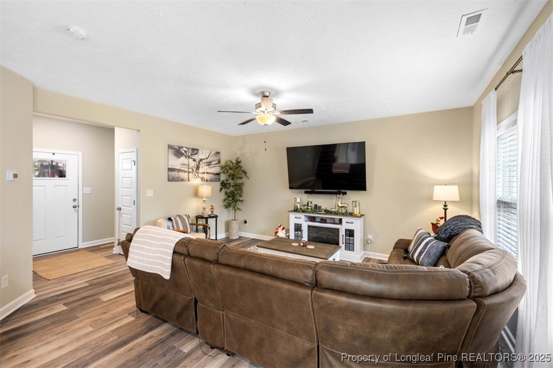 5512 Tolarsville Road St. Pauls, NC 28384 - Photo 7 of 30 a living room with furniture and a flat screen tv