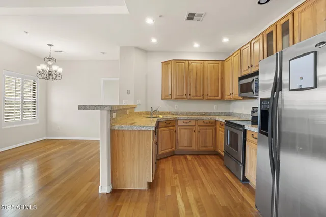 a view of kitchen with wooden floor