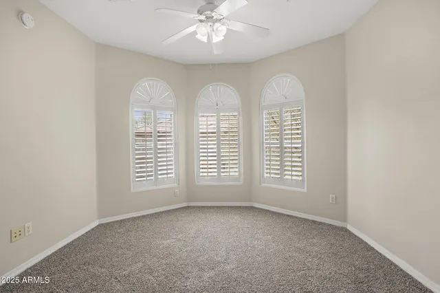 a view of a kitchen with a refrigerator and a stove top oven