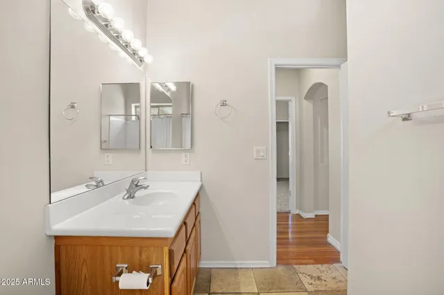 an empty room with a ceiling fan and a window