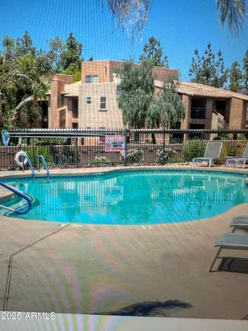 a living room with couches chairs and a coffee table
