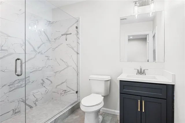 a bathroom with a sink toilet and vanity