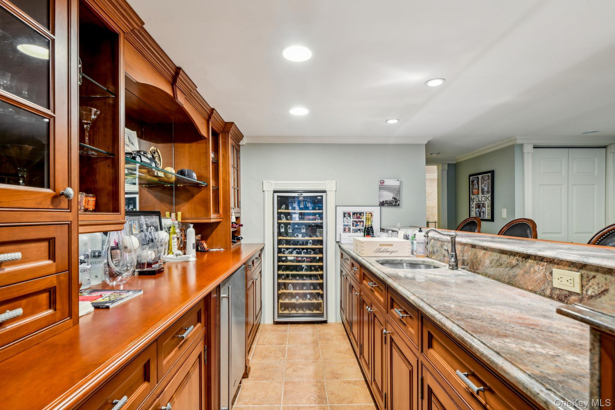 7 Short Path St. James, NY 11780 - Photo 6 of 17 Kitchen with brown cabinets, open shelves, wine cooler, recessed lighting, and light tile patterned floors