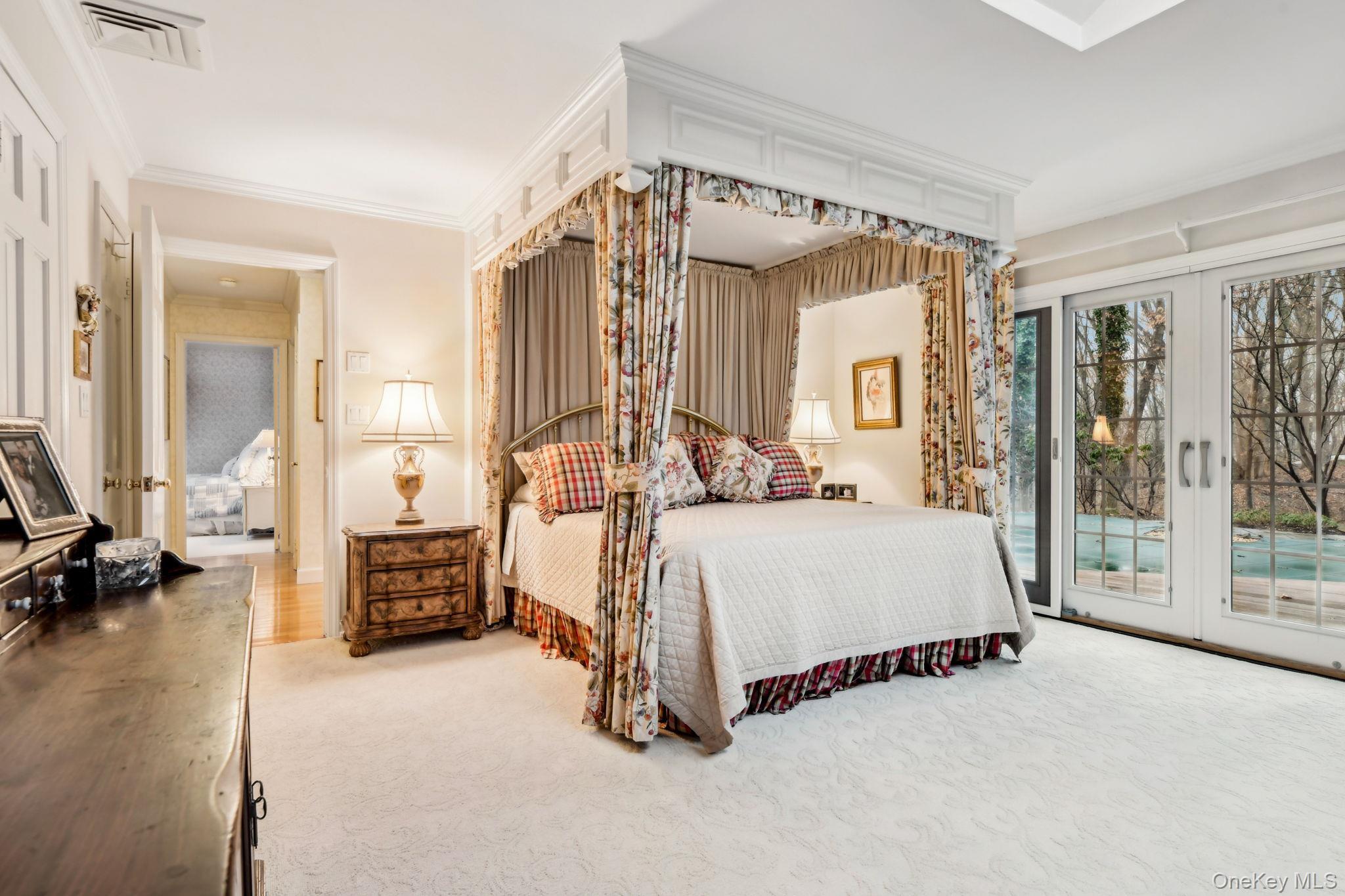 7 Short Path St. James, NY 11780 - Photo 10 of 17 Bedroom featuring french doors, access to exterior, carpet flooring, and crown molding