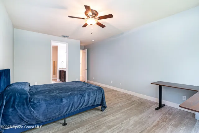 a living room with a bed furniture and a window
