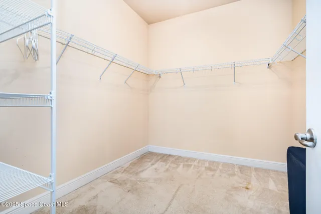 a view of a room with racks on the wall